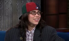 A woman sits on a talk show.