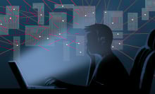 A man looks at this computer, surrounded by red lines connecting with data points.