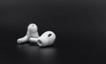 A pair of AirPods outside of their case.