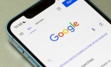 Homepage of Google.com, showing a Gemini link, is seen on an iPhone.