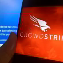 CrowdStrike logo over the Blue Screen of Death