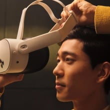 a man putting on a meta quest 3s headset
