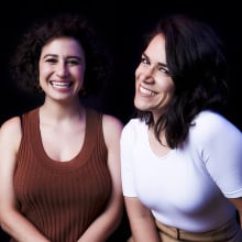 Abbi Jacobson and Ilana Glazer smiling in a portrait.