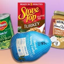 a frozen turkey, box of stuffing, can of green beans, and container of gravy from Target against a pink and purple background