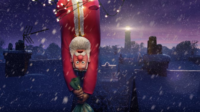Santa Claus hanging upside down.