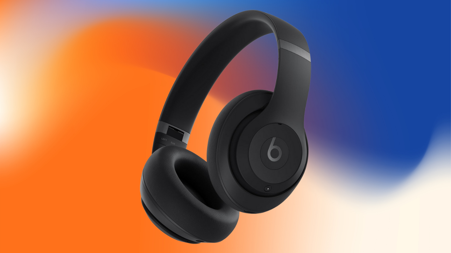 Beats Studio Pro on an orange, white and blue watercolor background
