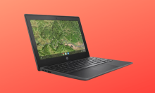 HP Chromebook on red-orange background