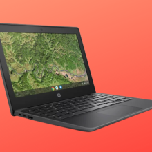 HP Chromebook on red-orange background