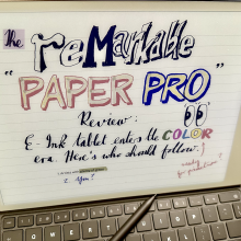 A Remarkable Paper Pro e-ink screen has a 'Remarkable Paper Pro' review written on it.