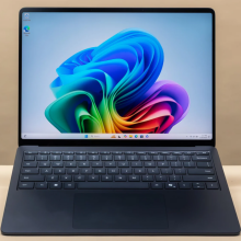 a microsoft surface laptop 7 against a beige wall with a prime big deal days tag overlaid